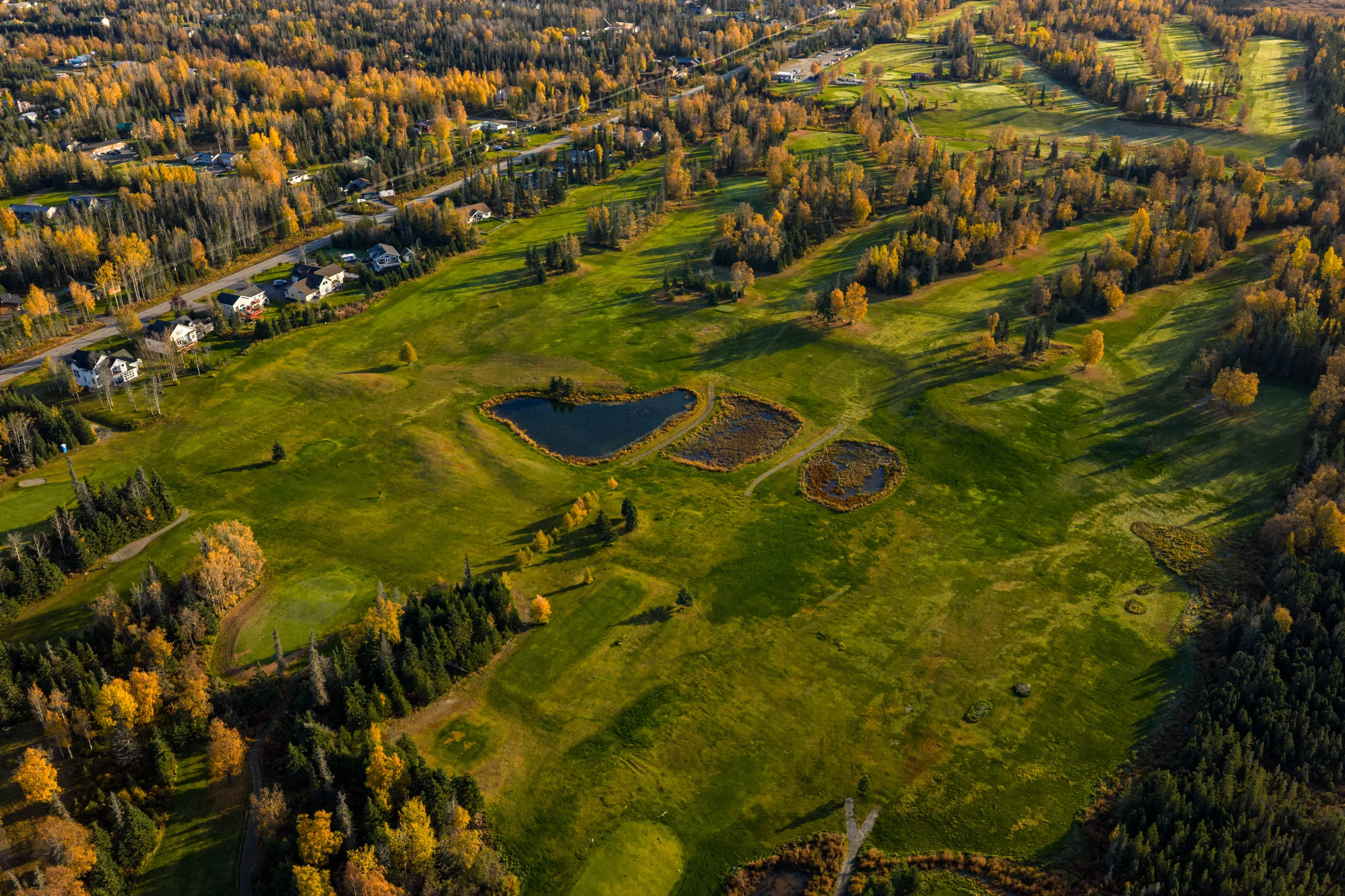 Practice putting green beside the Kenai Golf Course clubhouse